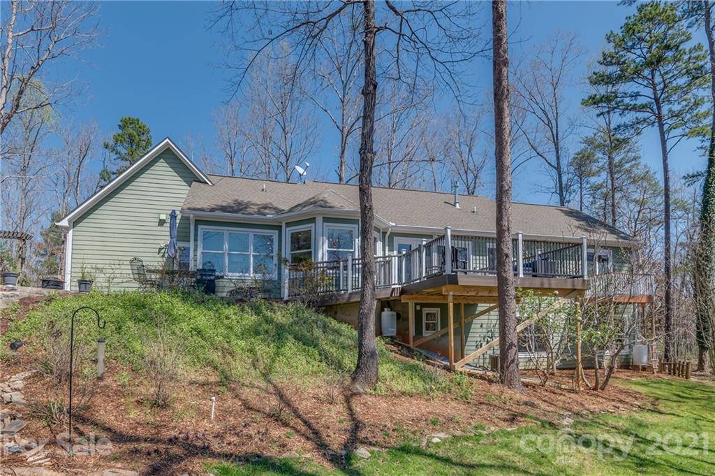 658 South Cove Road Mill Spring, NC 28756 - Photo 2 of 46 a view of a house with yard and a garden