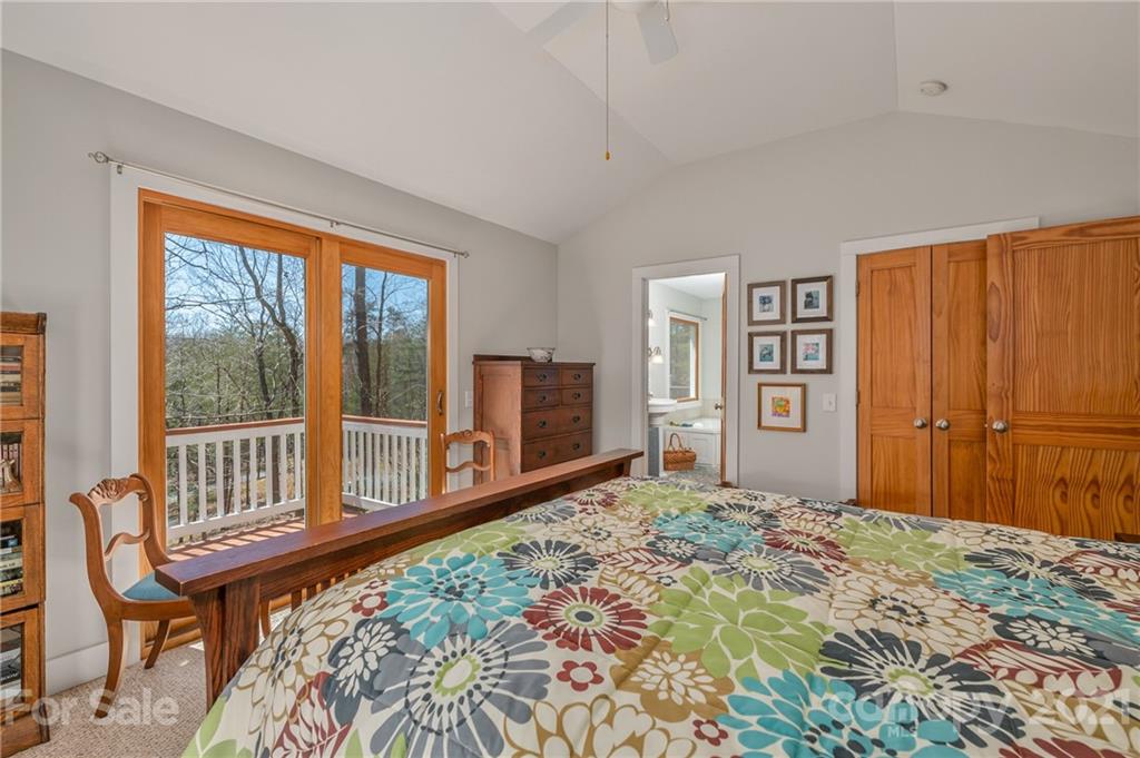 658 South Cove Road Mill Spring, NC 28756 - Photo 28 of 46 a bedroom with a bed and a large window