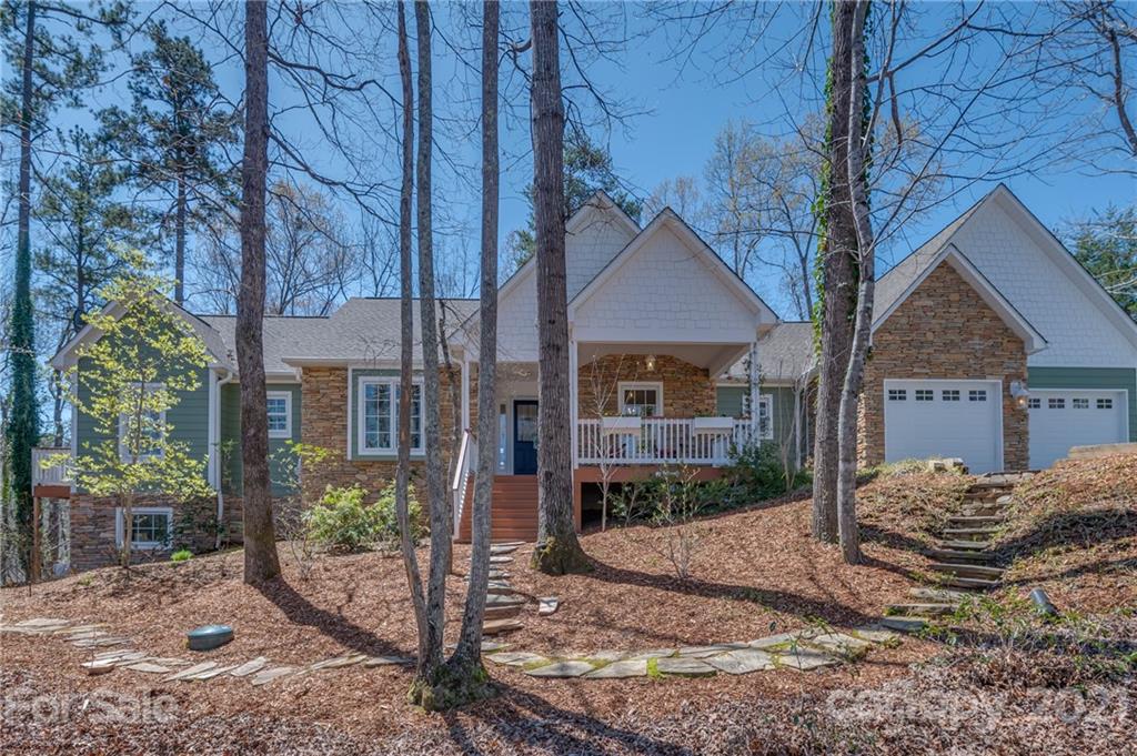 658 South Cove Road Mill Spring, NC 28756 - Photo 4 of 46 a view of a house with a yard