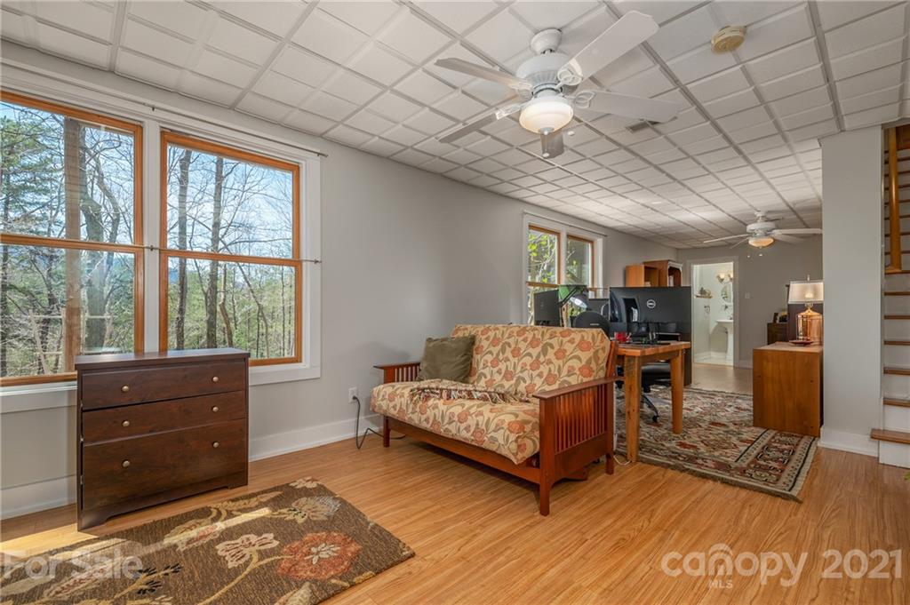 658 South Cove Road Mill Spring, NC 28756 - Photo 34 of 46 a living room with furniture and a flat screen tv
