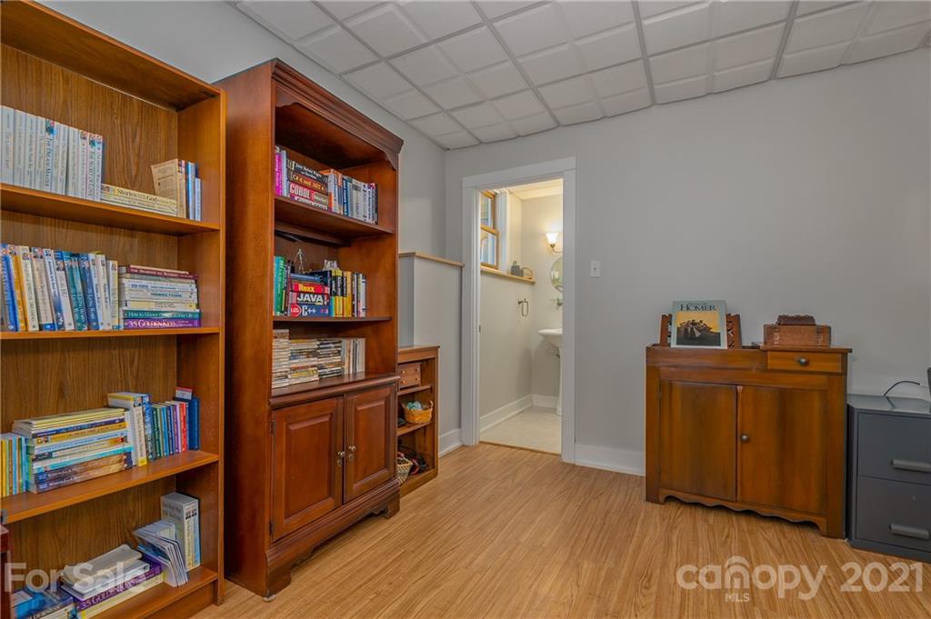 658 South Cove Road Mill Spring, NC 28756 - Photo 35 of 46 a room with bookshelf and wooden floor