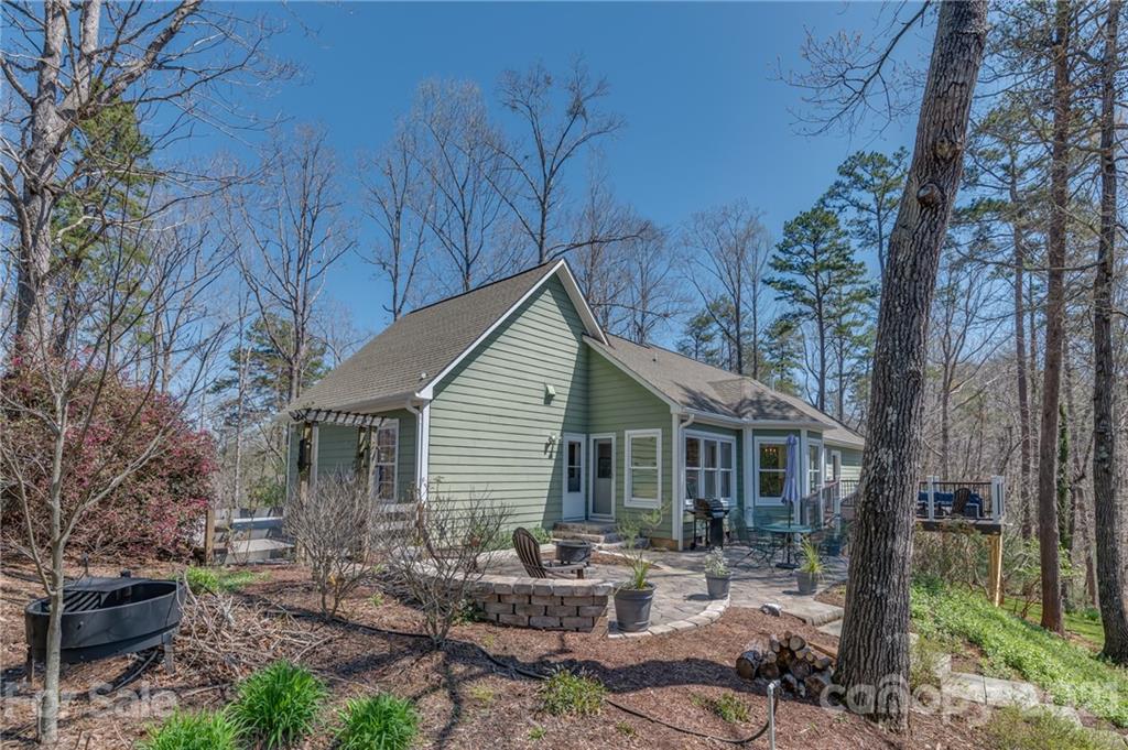 658 South Cove Road Mill Spring, NC 28756 - Photo 39 of 46 a backyard of a house with seating space