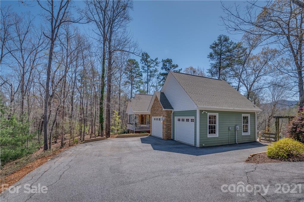 658 South Cove Road Mill Spring, NC 28756 - Photo 44 of 46 a view of a house with a large tree and a yard
