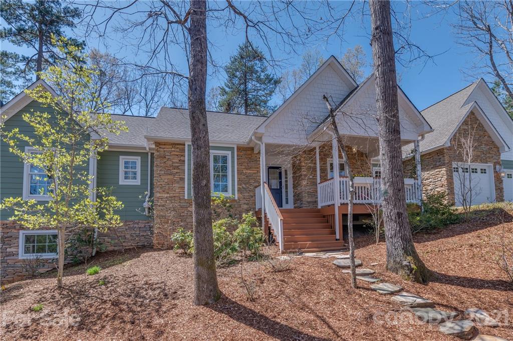 658 South Cove Road Mill Spring, NC 28756 - Photo 45 of 46 a front view of a house with garden