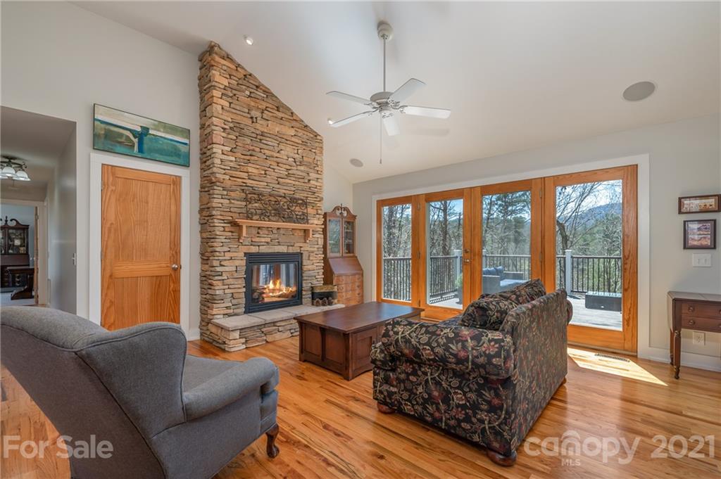 658 South Cove Road Mill Spring, NC 28756 - Photo 7 of 46 a living room with furniture and a fireplace