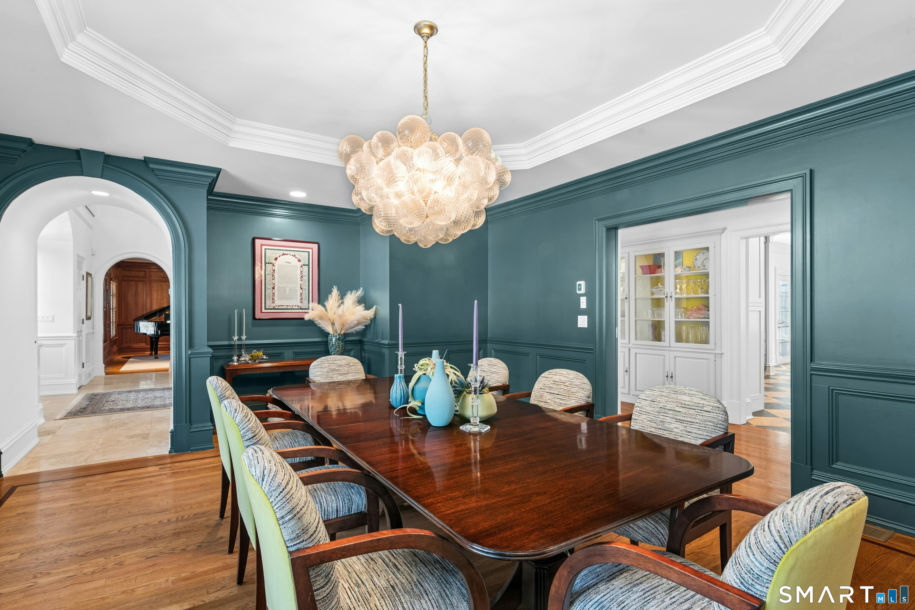 760 Smith Ridge Road New Canaan, CT 06840 - Photo 11 of 38 a view of a dining room with furniture and chandelier