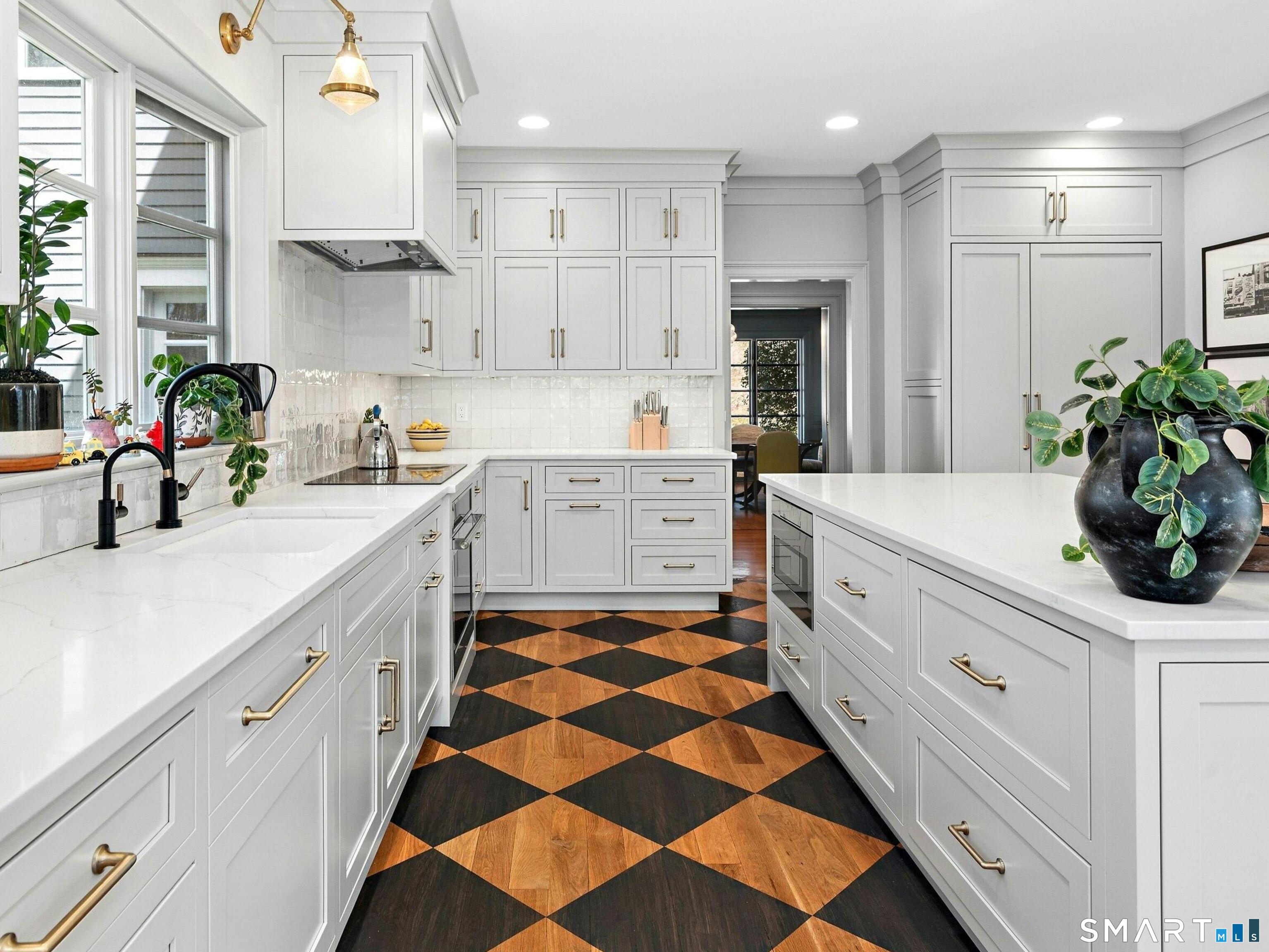 760 Smith Ridge Road New Canaan, CT 06840 - Photo 14 of 38 a kitchen with a sink a stove and cabinets