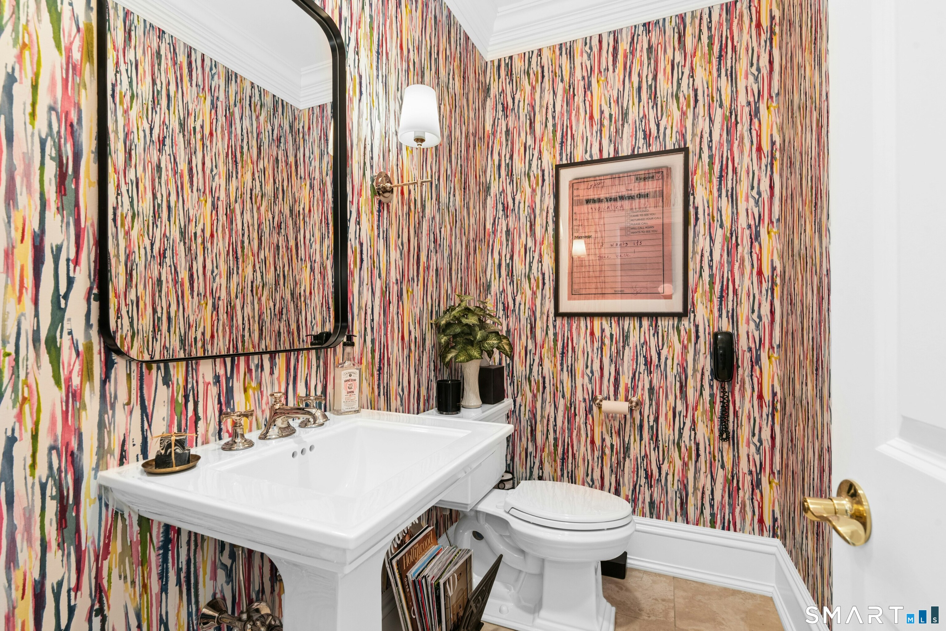 760 Smith Ridge Road New Canaan, CT 06840 - Photo 19 of 38 a bathroom with a sink a toilet and shower curtain