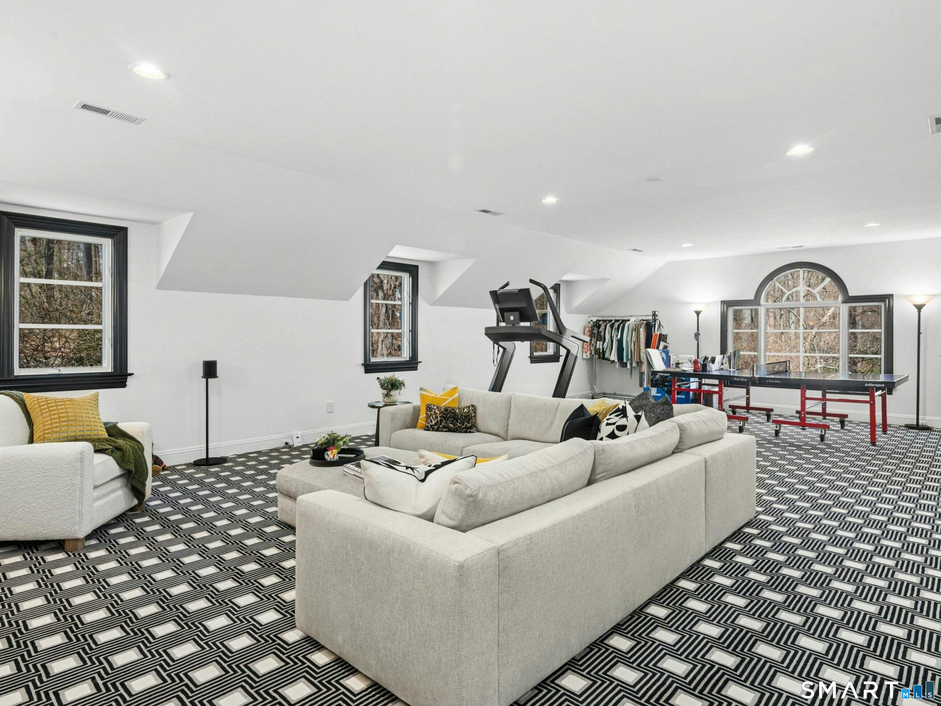 760 Smith Ridge Road New Canaan, CT 06840 - Photo 20 of 38 a living room with furniture a rug and a window