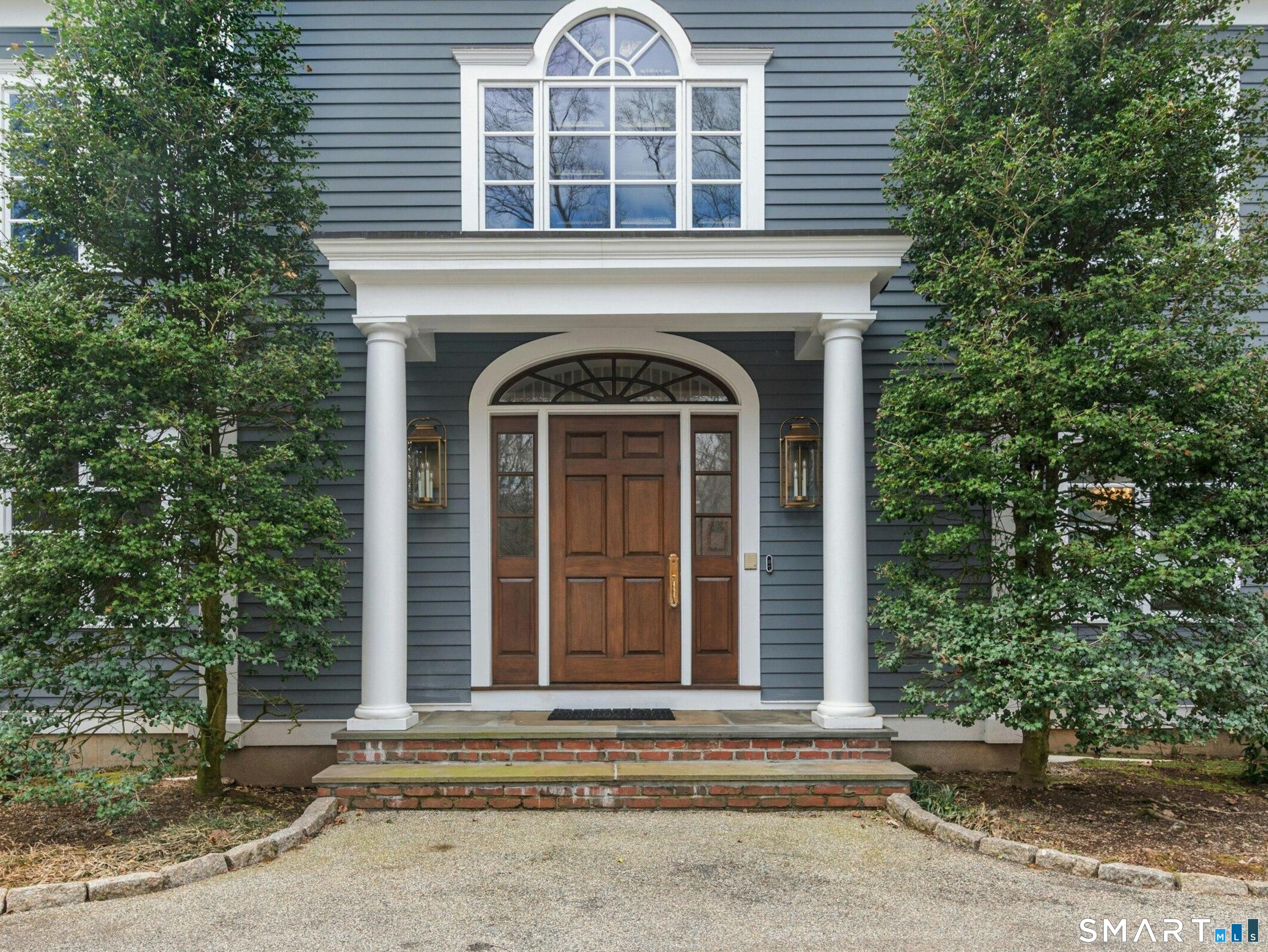 760 Smith Ridge Road New Canaan, CT 06840 - Photo 2 of 38 a front view of a house