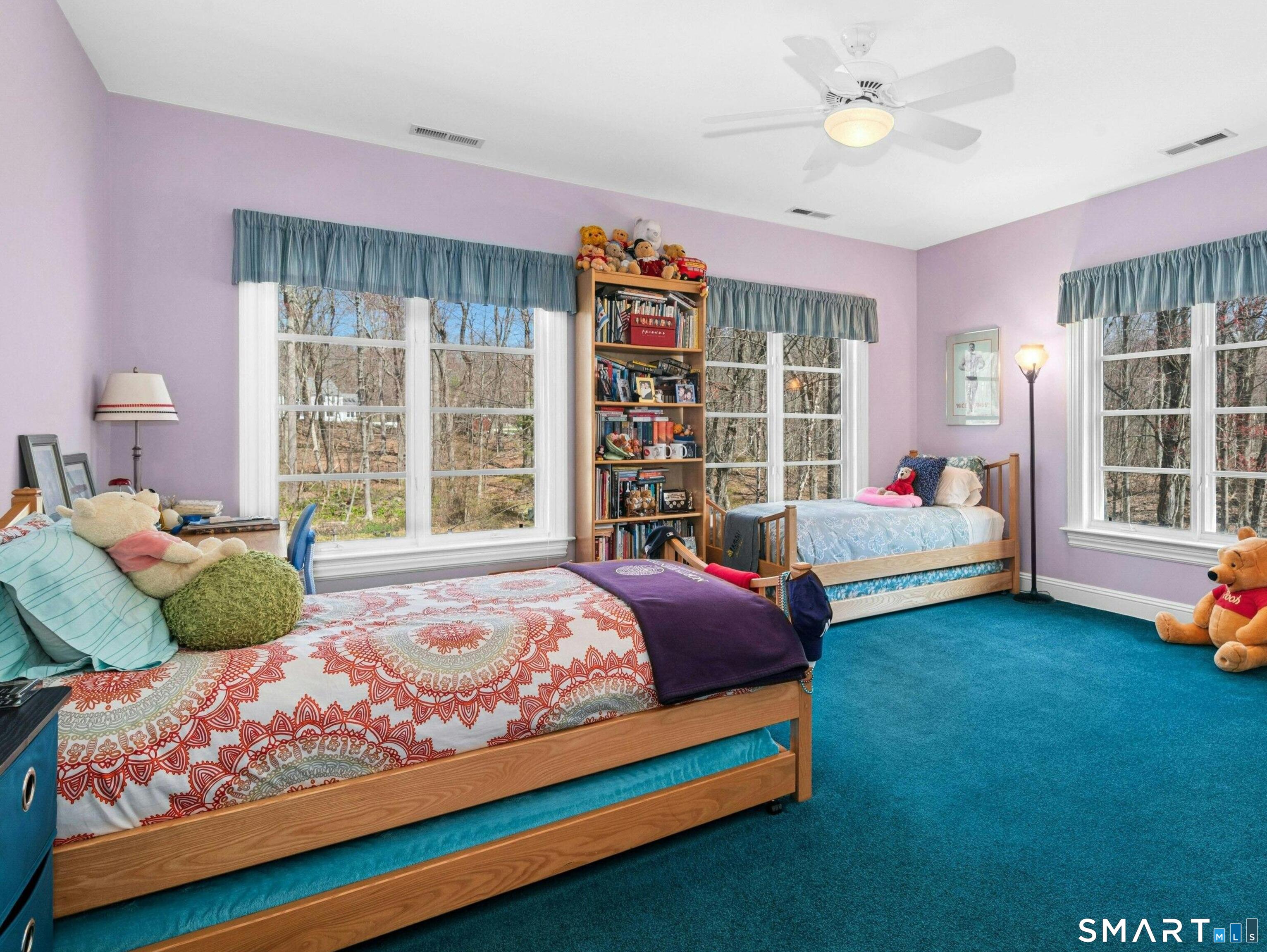 760 Smith Ridge Road New Canaan, CT 06840 - Photo 27 of 38 a bedroom with bed and a large window