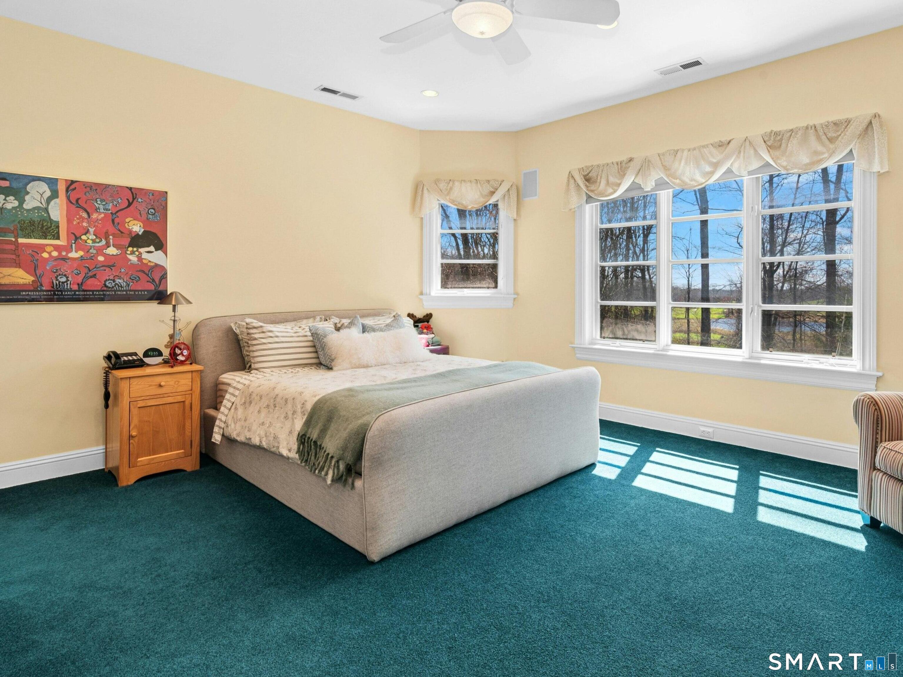 760 Smith Ridge Road New Canaan, CT 06840 - Photo 28 of 38 a bedroom with a bed and a large window