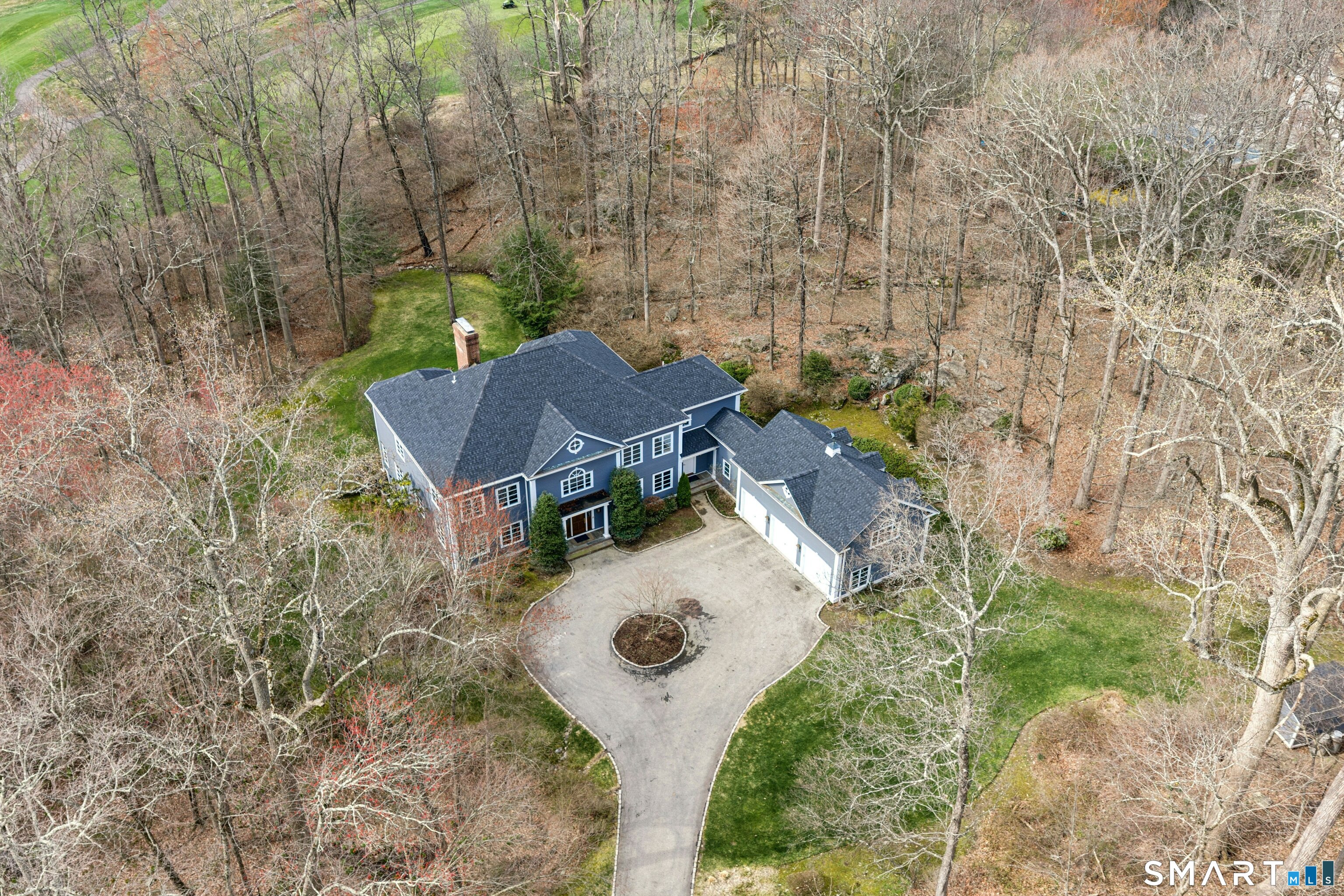 760 Smith Ridge Road New Canaan, CT 06840 - Photo 36 of 38 aerial view of a house with yard and outdoor seating