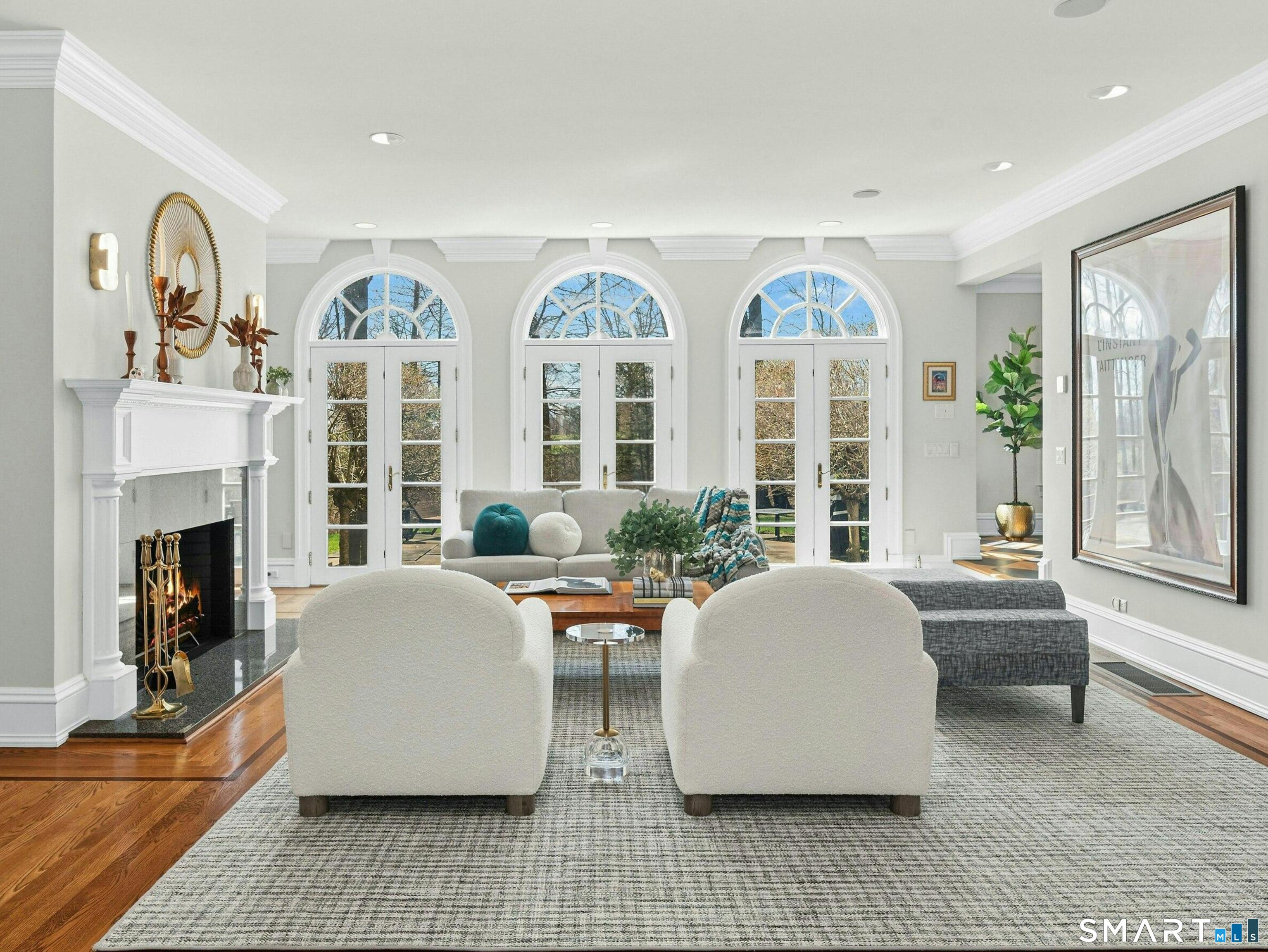 760 Smith Ridge Road New Canaan, CT 06840 - Photo 5 of 38 a living room with fireplace furniture and a large window