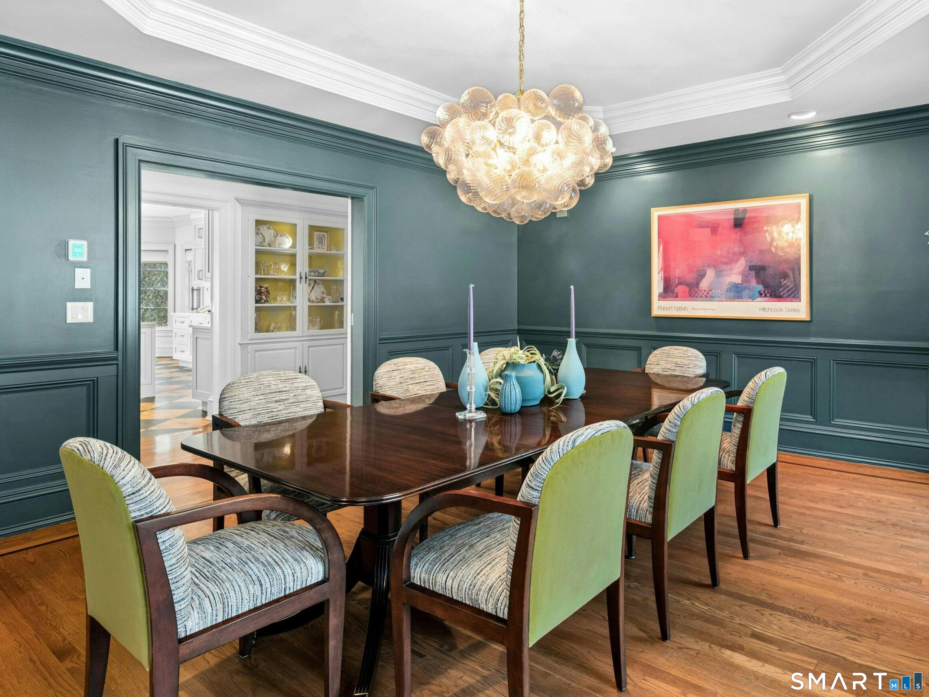 760 Smith Ridge Road New Canaan, CT 06840 - Photo 10 of 38 a view of a dining room with furniture wooden floor and chandelier