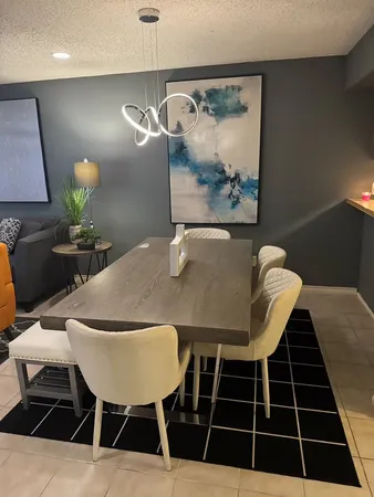 a view of a dining room with furniture and wooden floor