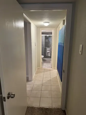 a view of hallway with a large mirror