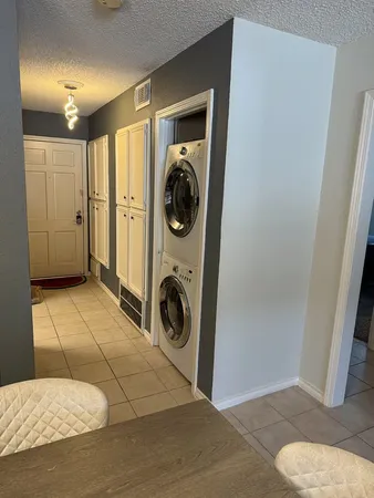 a view of a storage & utility room with washer and dryer