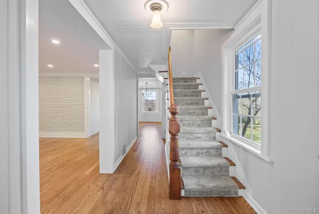 a view of entryway with wooden floor