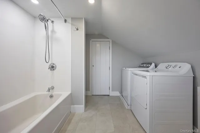 a view of bathroom with a tub sink