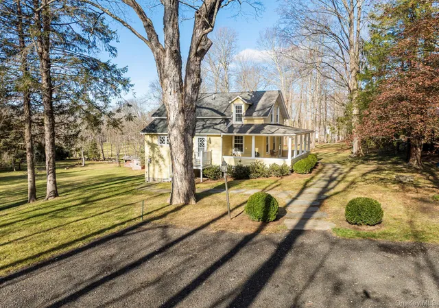 a view of a yard with wooden fence