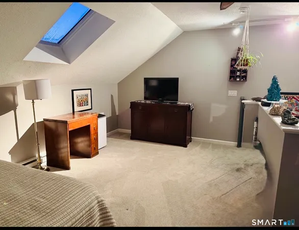 a bedroom with a bed and dresser