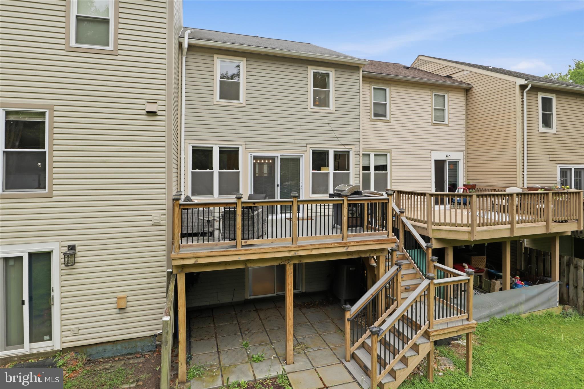 71 Kinsman View Circle Silver Spring, MD 20901 - Photo 31 of 42 a view of a house with a wooden deck