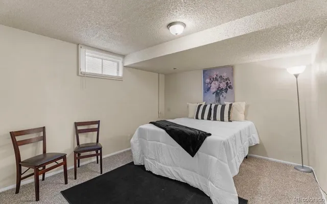 a bedroom with a bed and a furniture