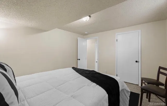 a kitchen with a sink cabinets and wooden floor