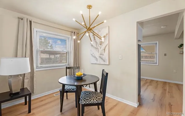 a living room with furniture a table and a window