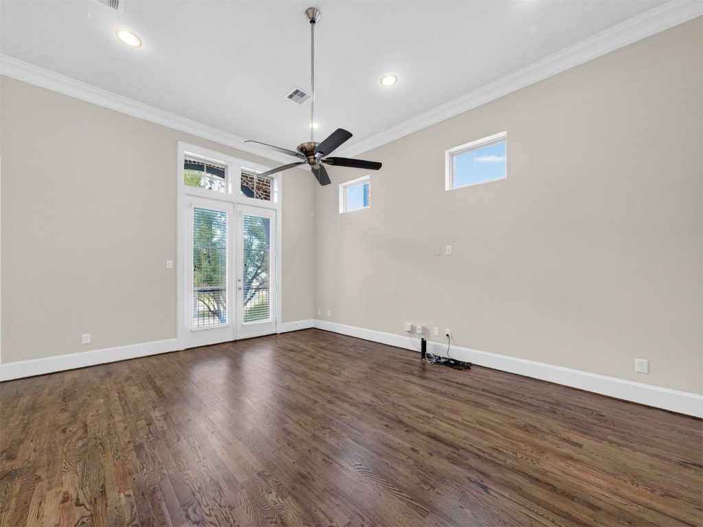 2810 Capitol Street Houston, TX 77003 - Photo 18 of 33 a view of an empty room with wooden floor and a window