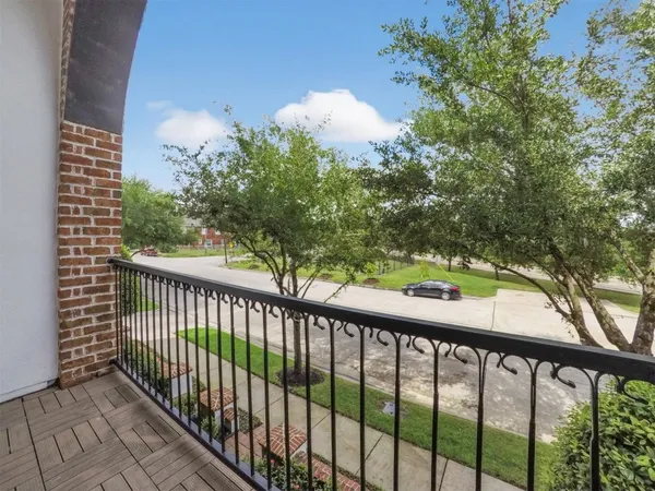 a view of a balcony with a pot