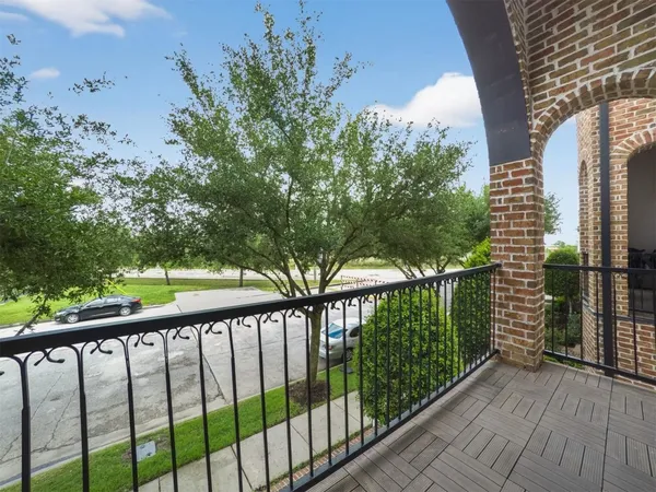 a view of a balcony with a pot