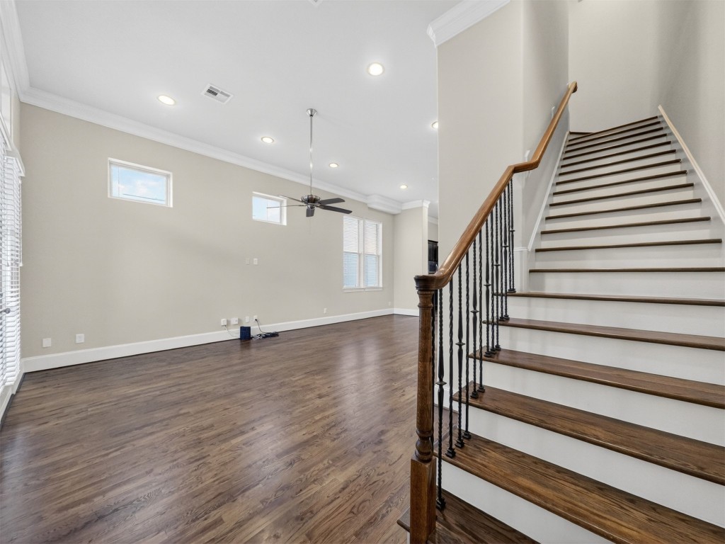 2810 Capitol Street Houston, TX 77003 - Photo 22 of 33 a view of a livingroom with wooden floor and stairs