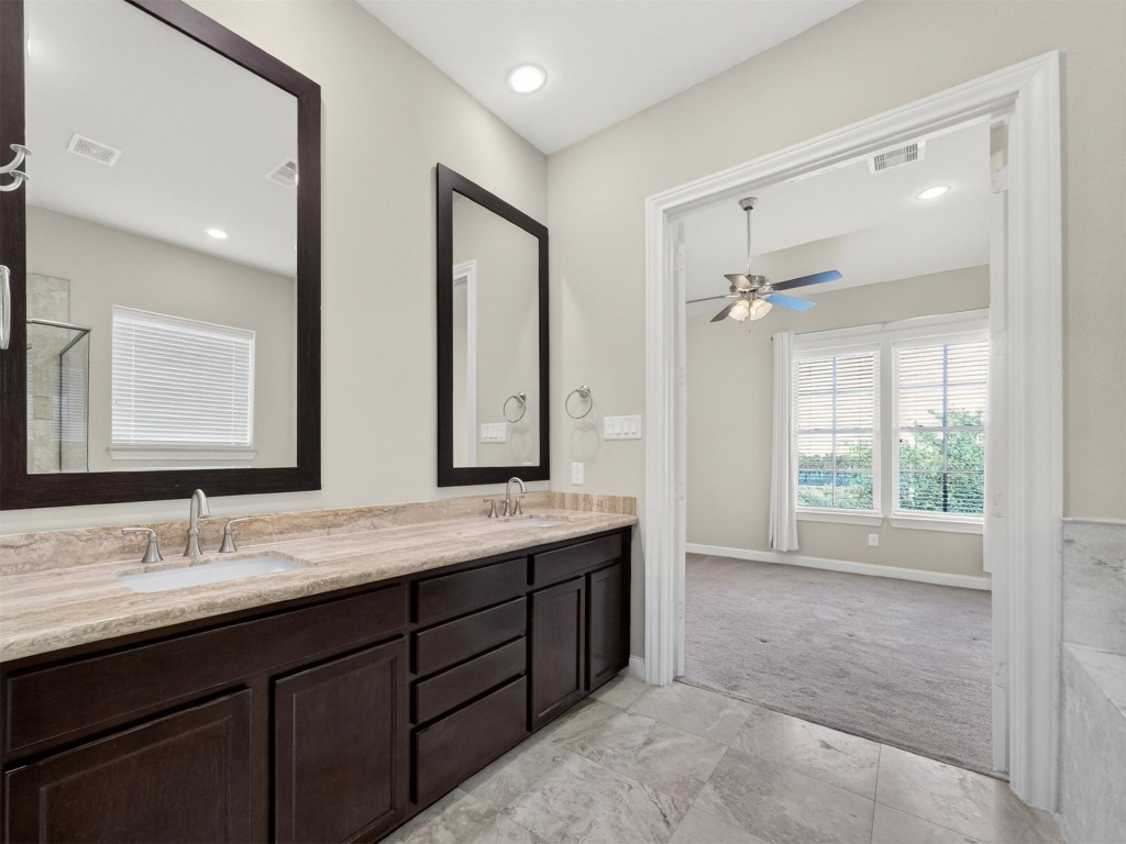 2810 Capitol Street Houston, TX 77003 - Photo 27 of 33 a bathroom with double vanity sinks and a mirror