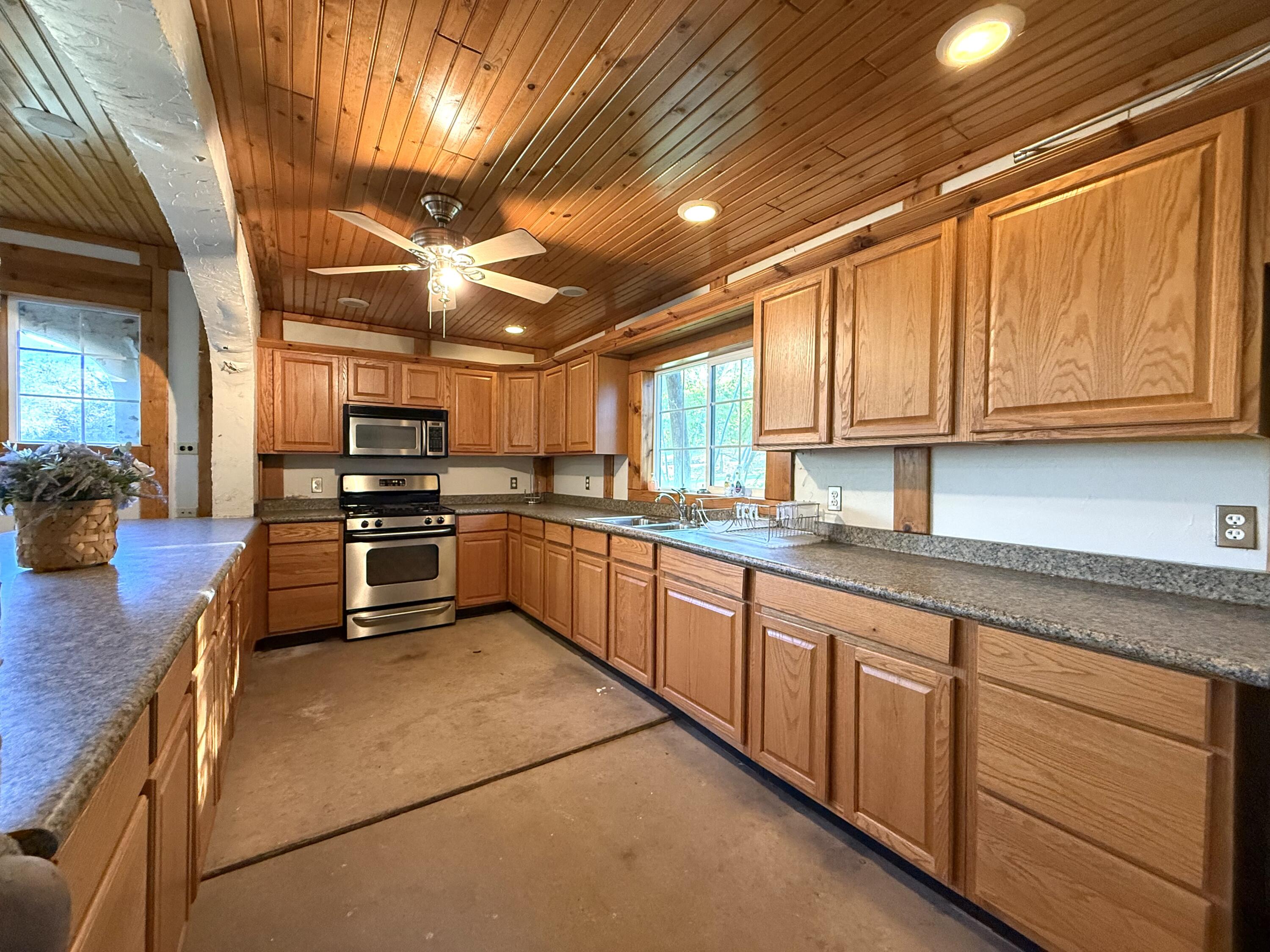 42751 North Fork Drive Three Rivers, CA 93271 - Photo 3 of 13 a kitchen with lots of counter top space and appliances
