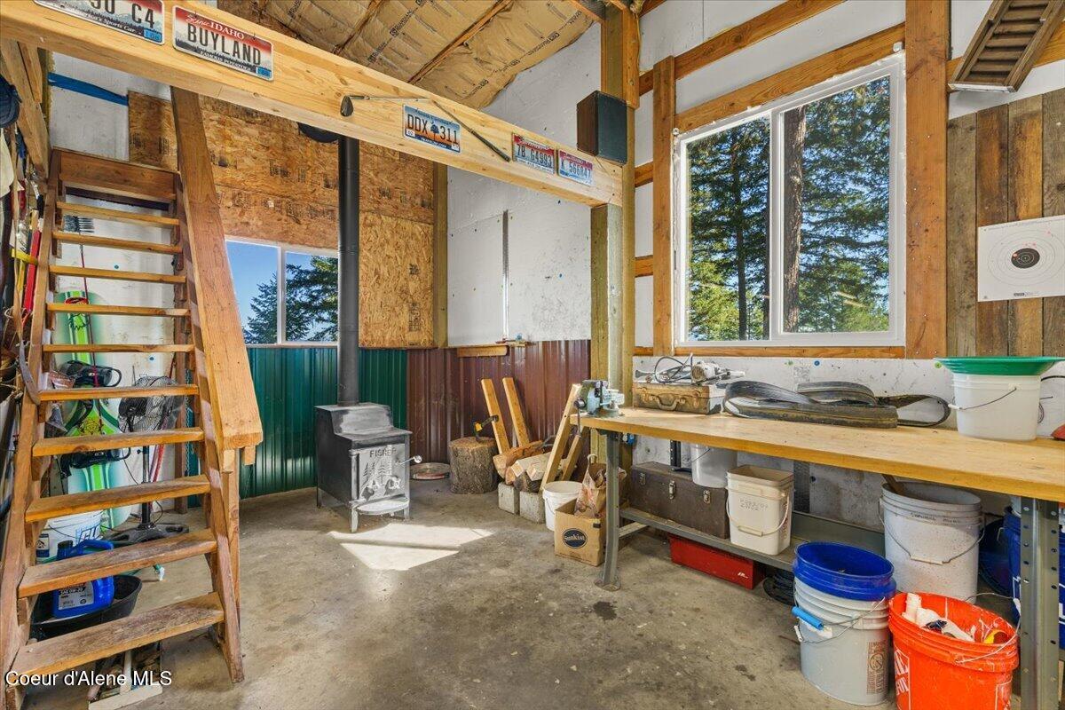 7497 East Forest View Road Athol, ID 83801 - Photo 31 of 55 Stairs to loft & wood stove for heat