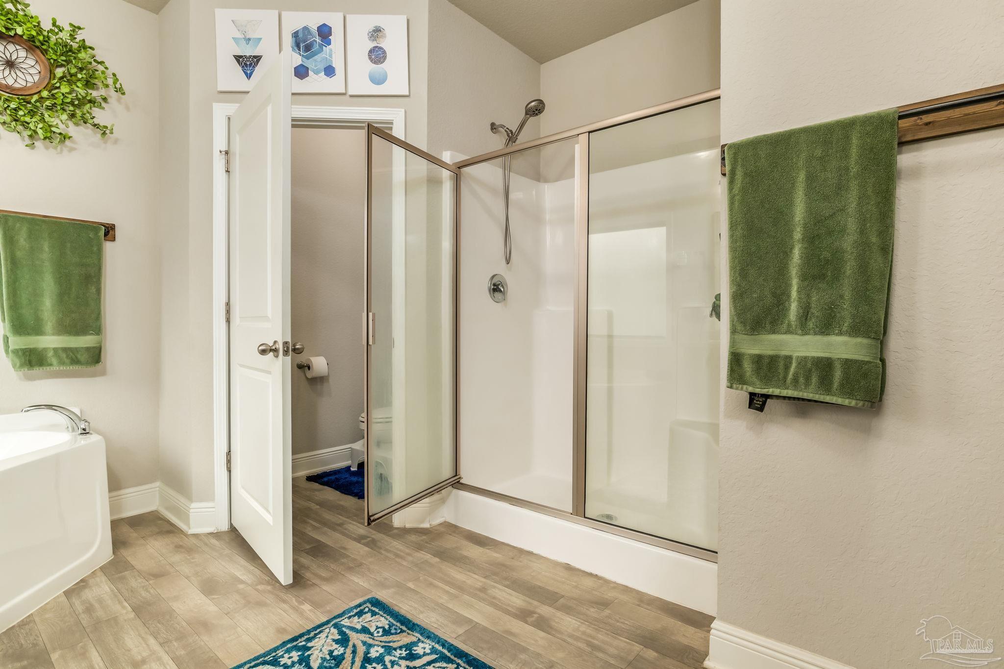 5185 Parkside Drive Pace, FL 32571 - Photo 13 of 43 a bathroom with a shower and a sink