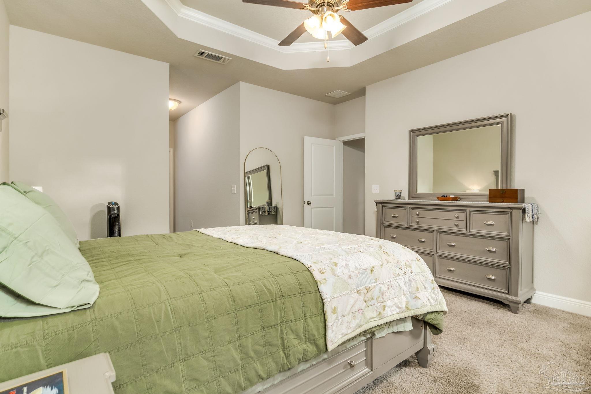 5185 Parkside Drive Pace, FL 32571 - Photo 17 of 43 a bedroom with a bed and a dresser