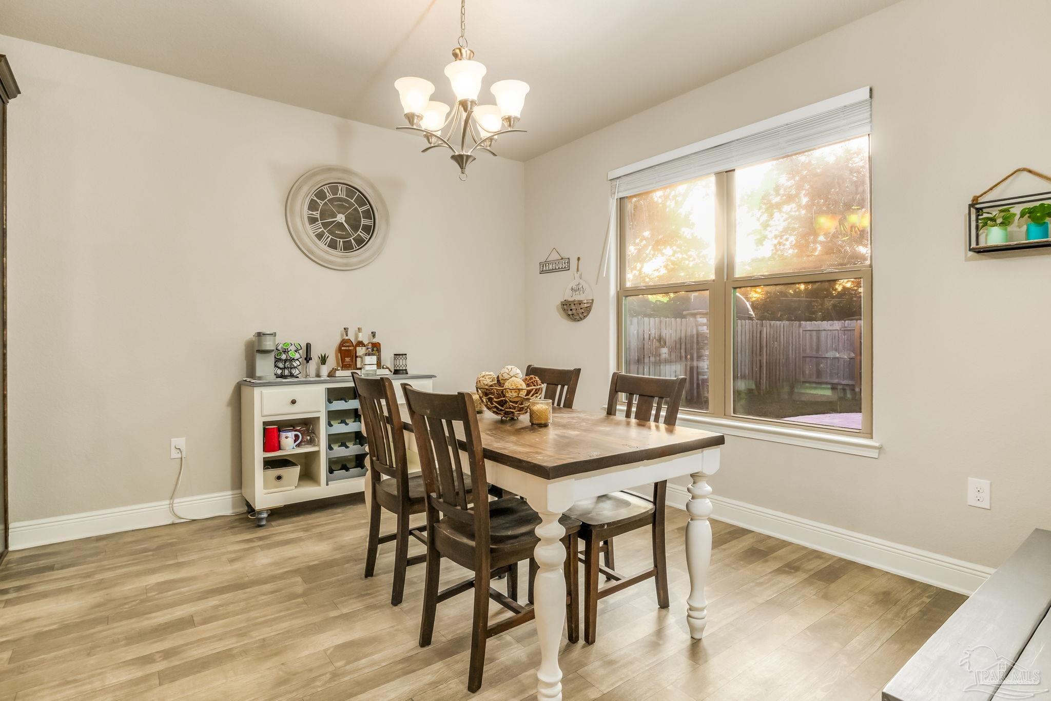 5185 Parkside Drive Pace, FL 32571 - Photo 20 of 43 a view of a dining room with furniture window and outside view