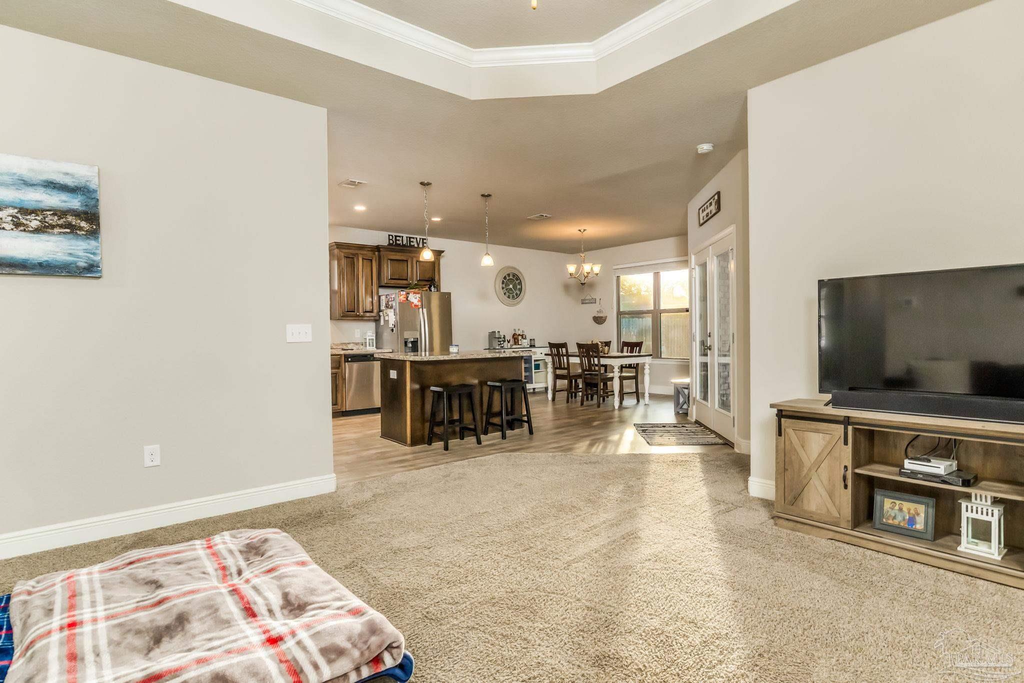 5185 Parkside Drive Pace, FL 32571 - Photo 27 of 43 a living room with furniture and kitchen view