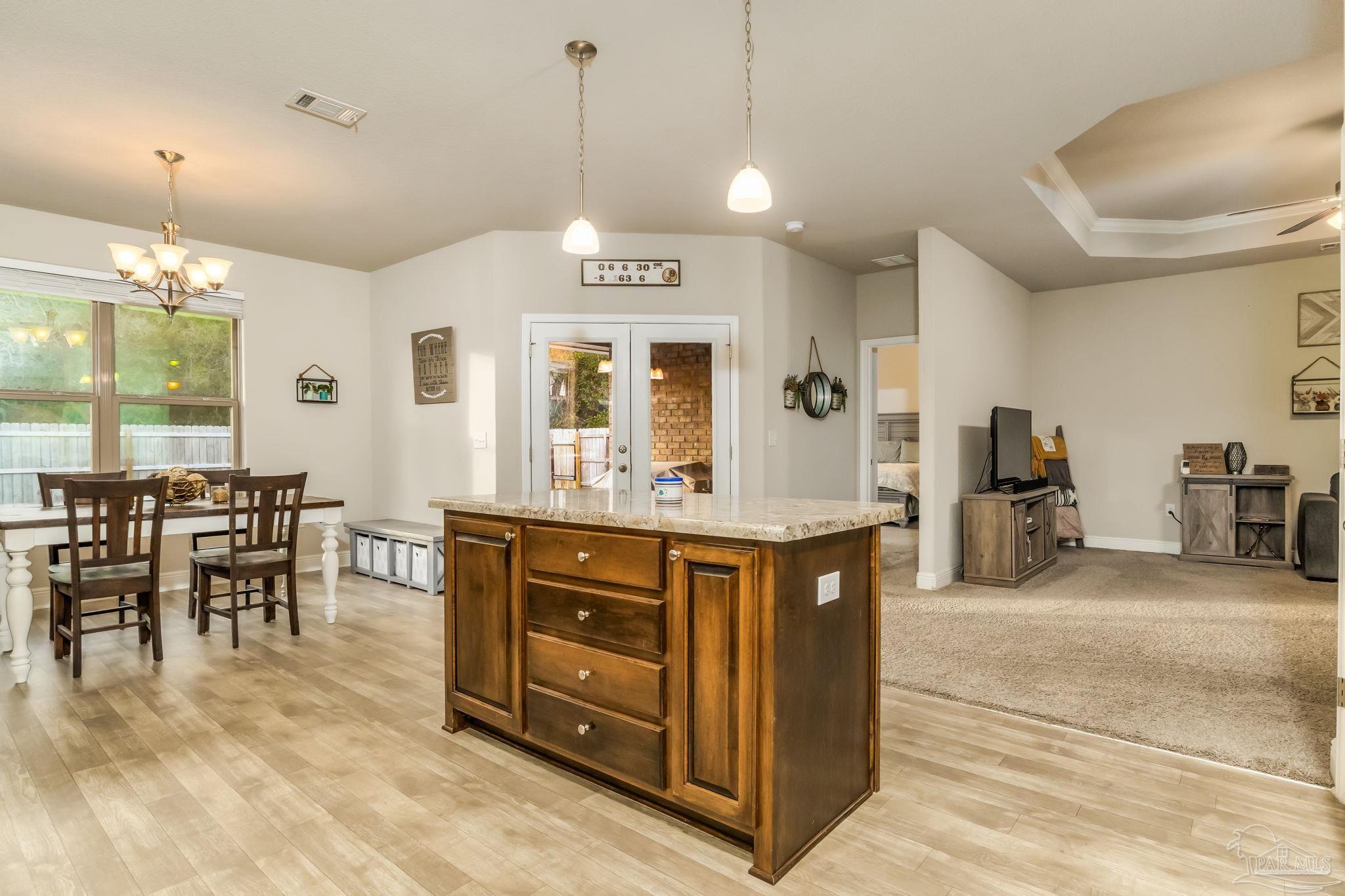 5185 Parkside Drive Pace, FL 32571 - Photo 29 of 43 a view of kitchen center island and living room