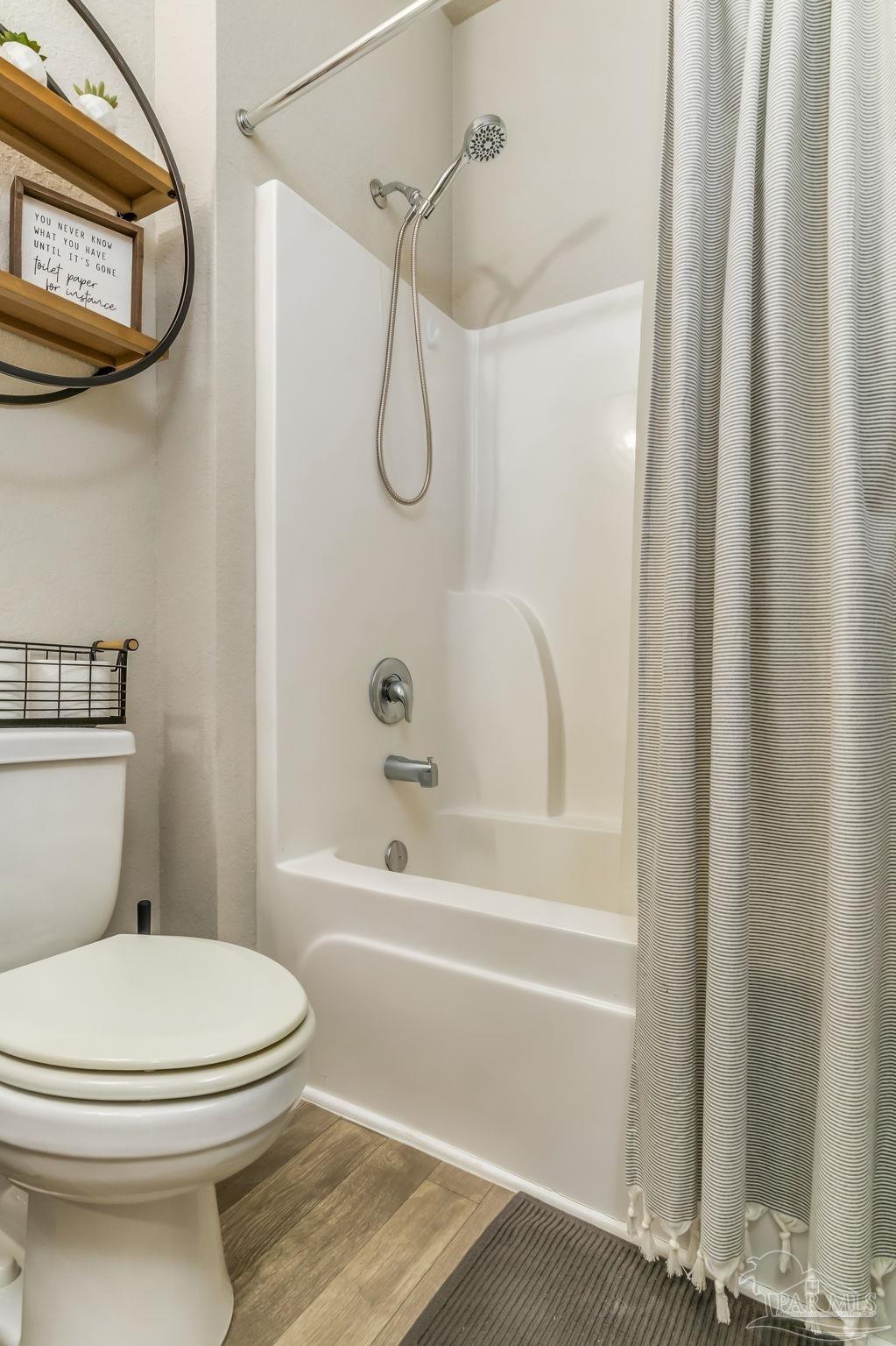 5185 Parkside Drive Pace, FL 32571 - Photo 41 of 43 a bathroom with a toilet and a shower