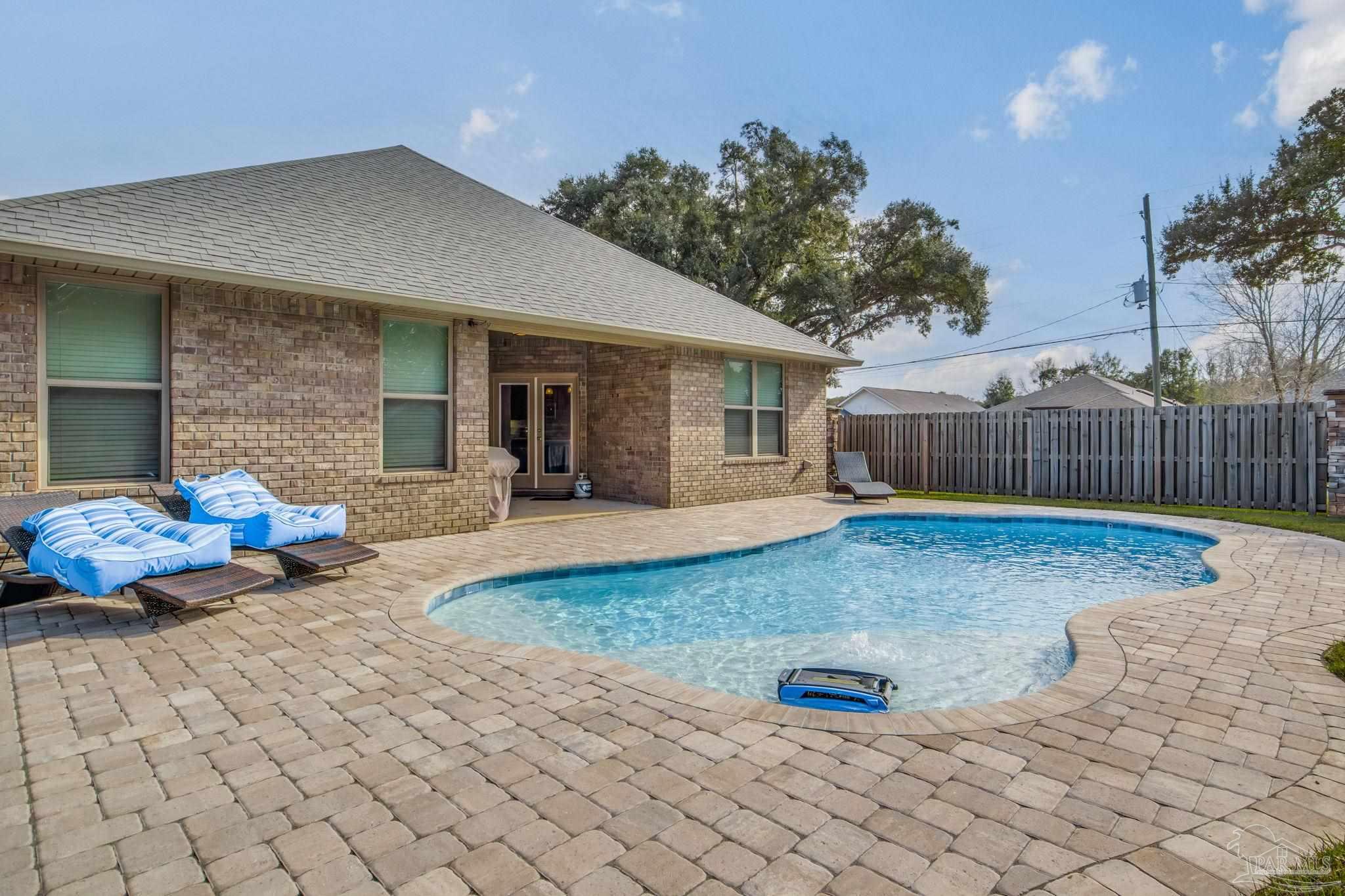 5185 Parkside Drive Pace, FL 32571 - Photo 10 of 43 a view of a house with backyard and sitting area
