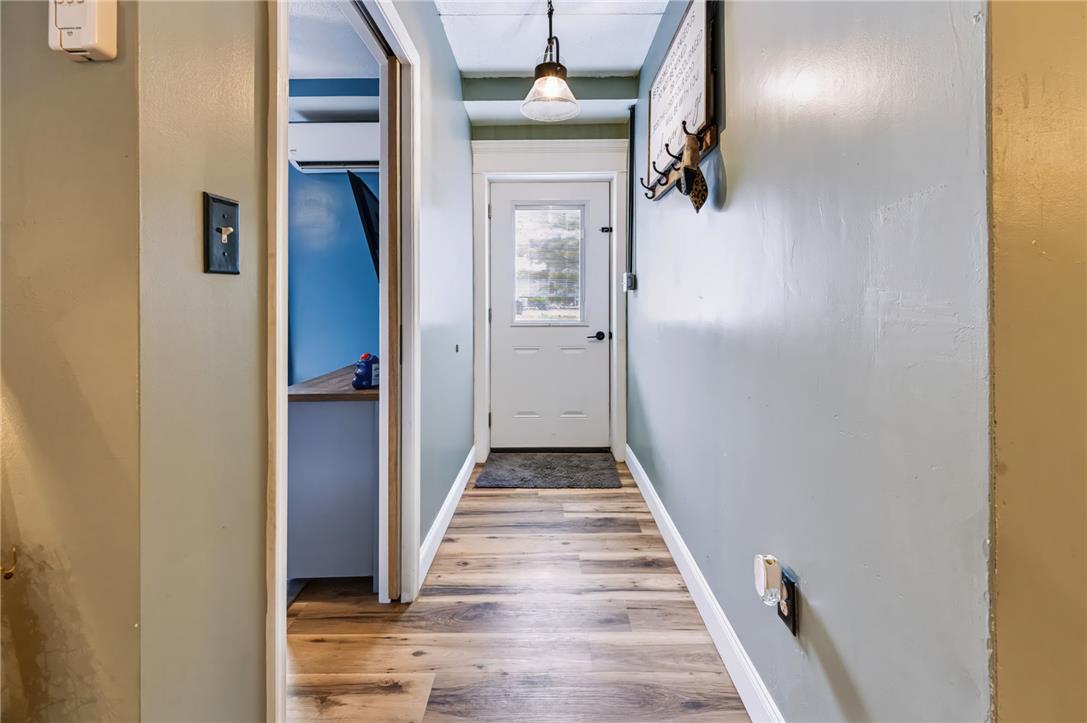 74 Turkey Road Kempton, PA 19529 - Photo 30 of 65 A welcoming entryway features wood plank flooring and a frosted glass-paneled door.