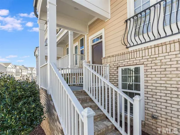 a view of a house with wooden stairs