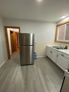 5225 West Deming Place, Unit 2 Chicago, IL 60639 - Photo 12 of 29 a kitchen with stainless steel appliances a refrigerator and a stove top oven