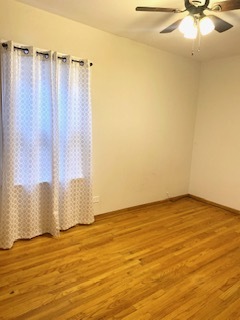 5225 West Deming Place, Unit 2 Chicago, IL 60639 - Photo 15 of 29 a view of a room with wooden floor and a window