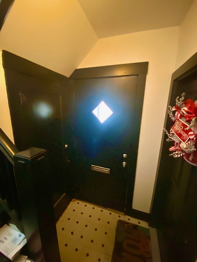 5225 West Deming Place, Unit 2 Chicago, IL 60639 - Photo 2 of 29 a bathroom with a sink and a mirror