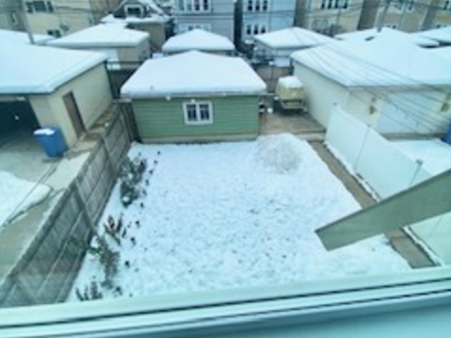 5225 West Deming Place, Unit 2 Chicago, IL 60639 - Photo 26 of 29 a bathroom with a sink and mirror